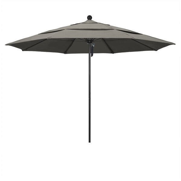 A close up of a California Umbrella with a black pole and taupe canopy.
