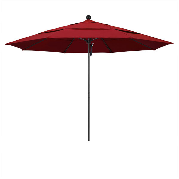 A red California Umbrella on a black pole.