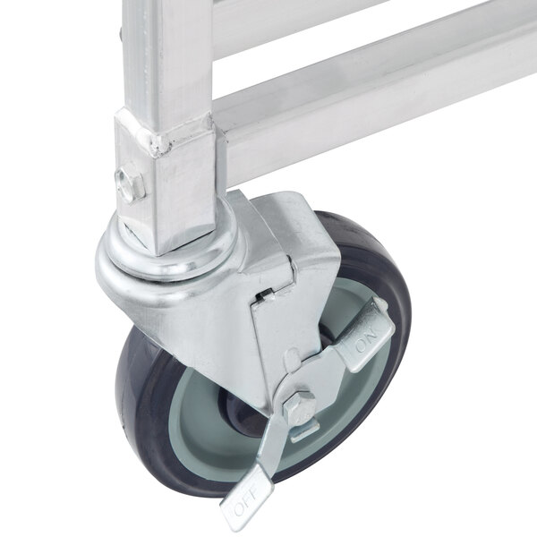 A close-up of a 5" swivel stem caster wheel on a metal frame.