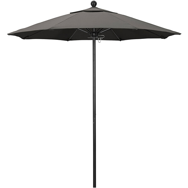 A black California Umbrella on a black metal pole.