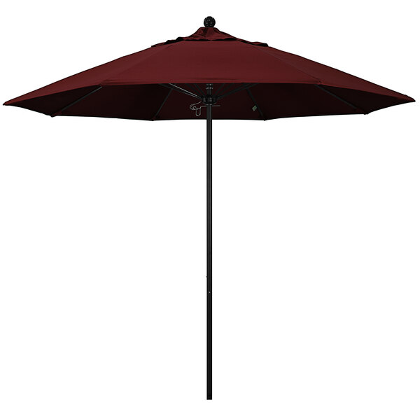 A red California Umbrella with a black pole on a white background.