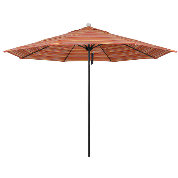 A close-up of a California Umbrella with a striped Dolce Mango canopy on a black pole.