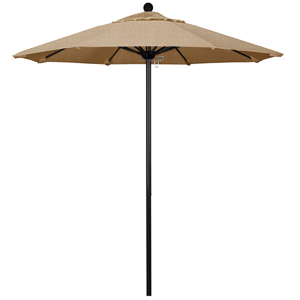 A tan California Umbrella ALTO round outdoor umbrella on a black pole.