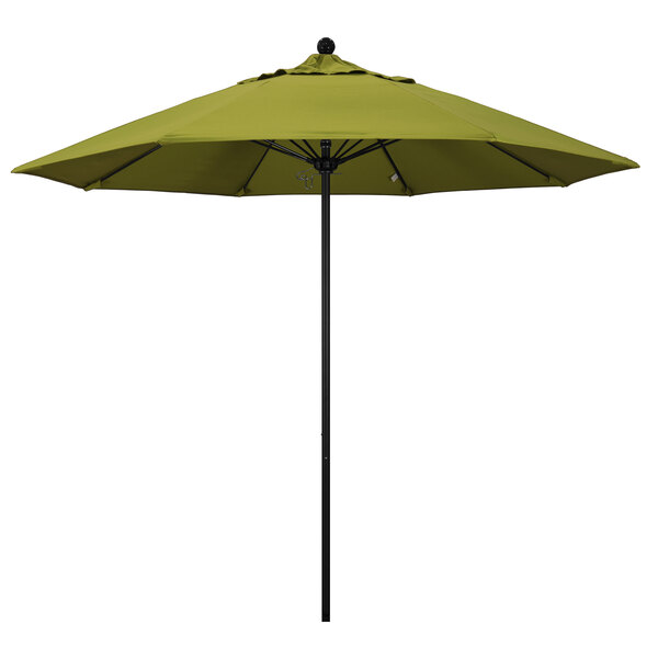 A green California Umbrella on a black pole.