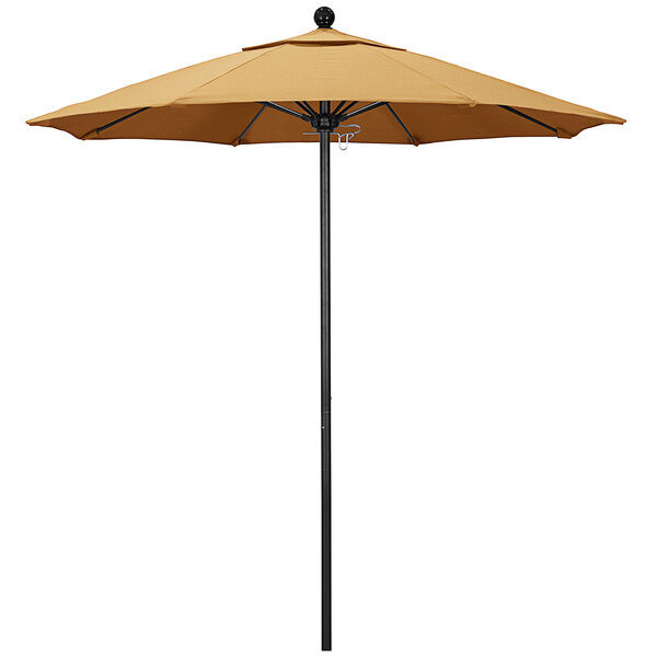 A California Umbrella ALTO round outdoor umbrella with Sunbrella wheat fabric on a black pole.