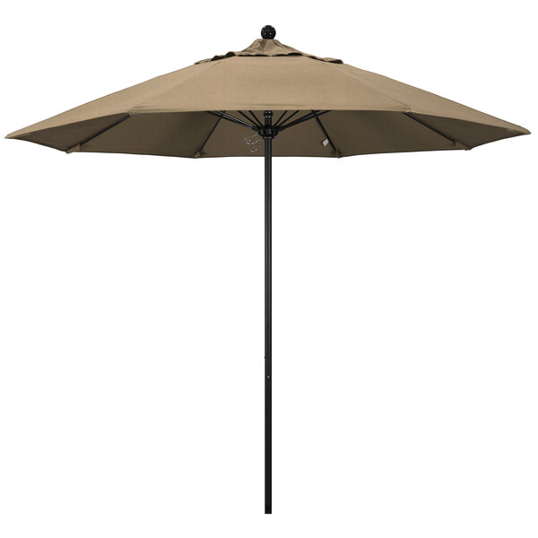 A California Umbrella ALTO round outdoor umbrella with a Heather Beige Sunbrella canopy on a black pole.