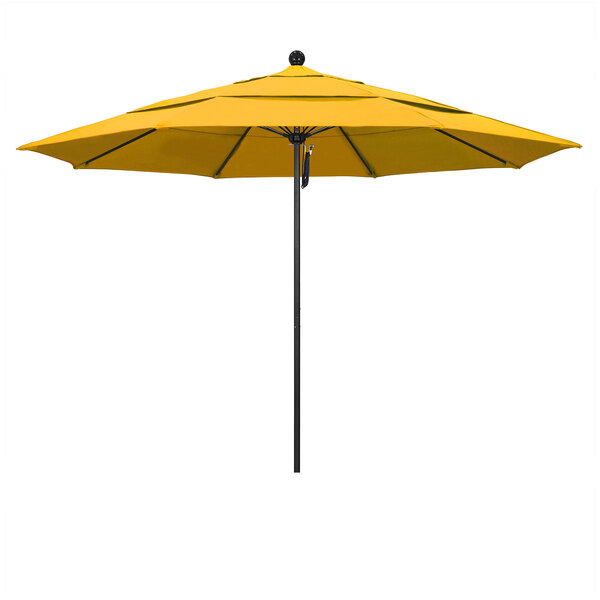 A close-up of a yellow California Umbrella with a black pole.
