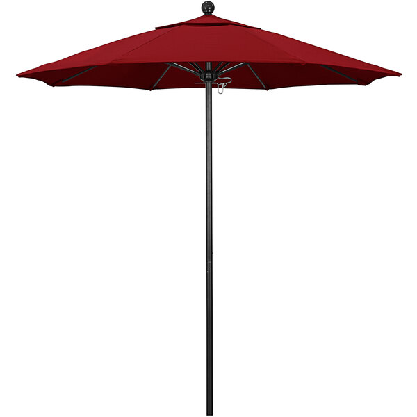 A red California Umbrella on a black aluminum pole.