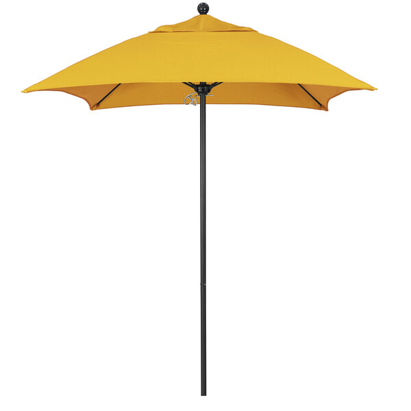 A California Umbrella sunflower yellow umbrella on a black pole on a white background.