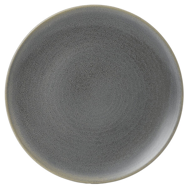 A close up of a Dudson Matte Granite stoneware plate with a speckled grey rim.