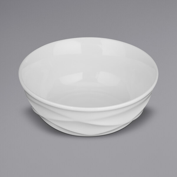 A white bowl with an embossed white rim.