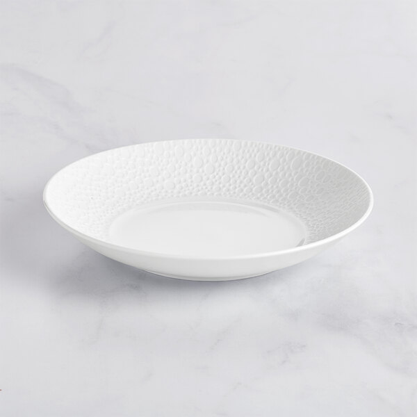 A Sant'Andrea Francia bright white porcelain bowl with a textured pattern.