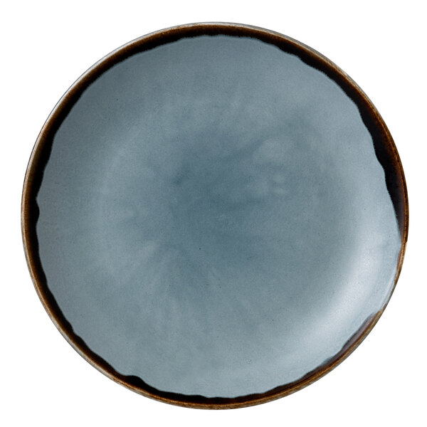 A close up of a Dudson Harvest blue china plate with a brown rim.