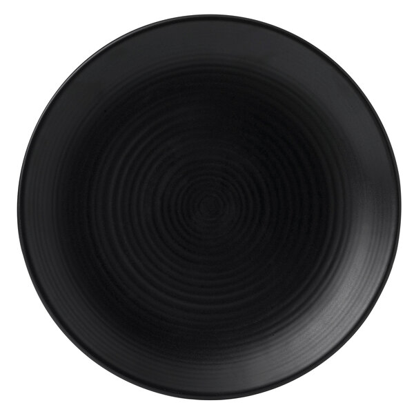 A black Dudson stoneware plate with a circular spiral pattern.