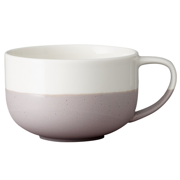 A white porcelain cappuccino cup with a grey speckle pattern and handle.