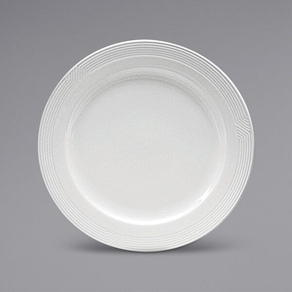 A white Sant'Andrea Impressions porcelain plate with a pattern on the rim.