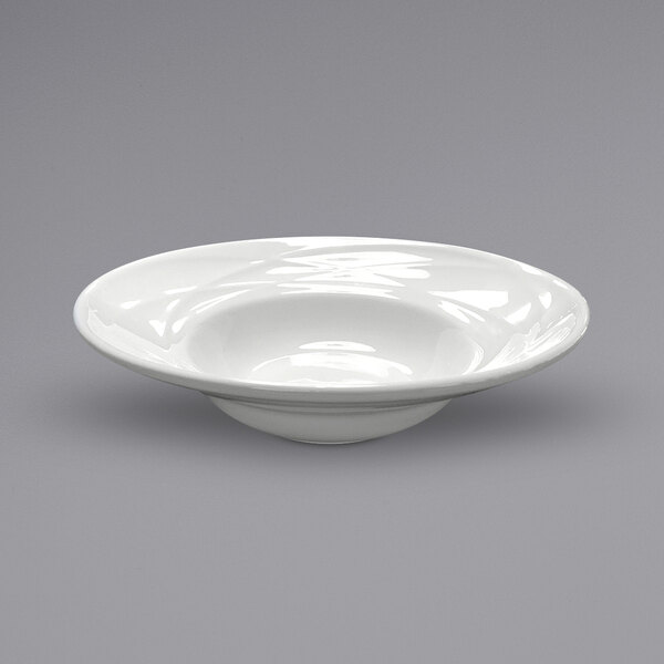A Sant'Andrea Pensato white porcelain deep salad bowl with a wide rim and circular pattern.