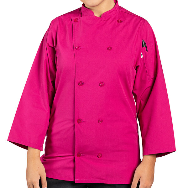 A woman wearing a berry colored 3/4 length sleeve chef coat with side vents.