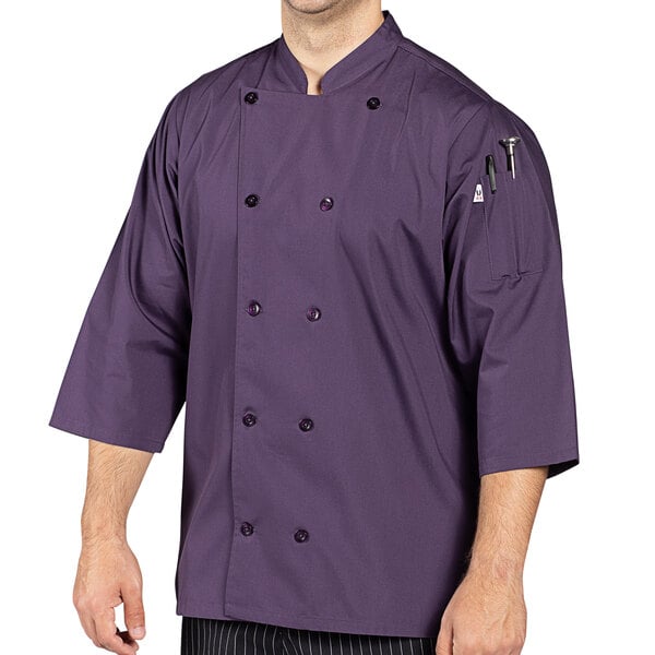 A man wearing an Uncommon Chef purple 3/4 length sleeve chef coat.