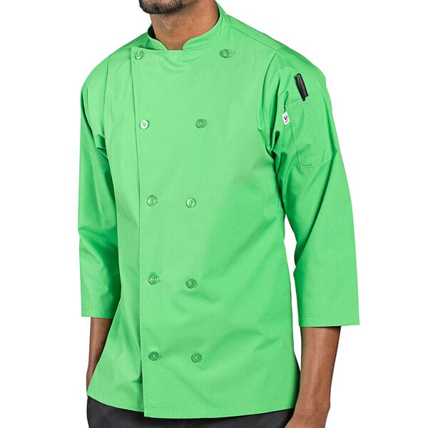 A man wearing a lime green Uncommon Chef 3/4 sleeve chef coat.