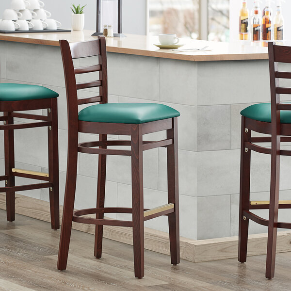 Lancaster Table & Seating Mahogany Ladder Back Bar Height Chair with Green Padded Seat