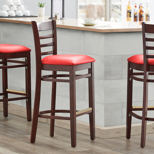 Lancaster Table & Seating Mahogany Ladder Back Bar Height Chair with Red Padded Seat