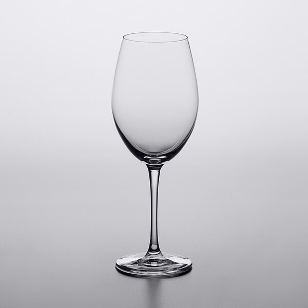 A Lucaris Bliss Cabernet wine glass on a table.