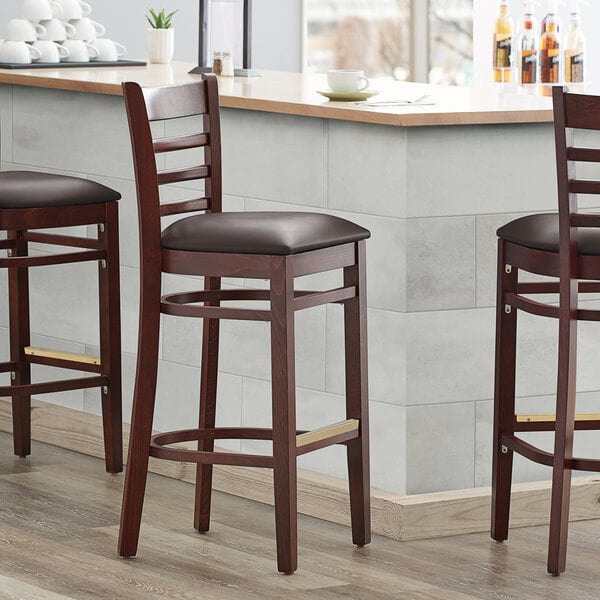 Lancaster Table & Seating Mahogany Ladder Back Bar Height Chair with Dark Brown Padded Seat