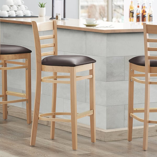 Lancaster Table & Seating Natural Ladder Back Bar Height Chair with 2 1/2" Dark Brown Padded Seat