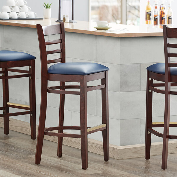 Lancaster Table & Seating Mahogany Ladder Back Bar Height Chair with Navy Padded Seat