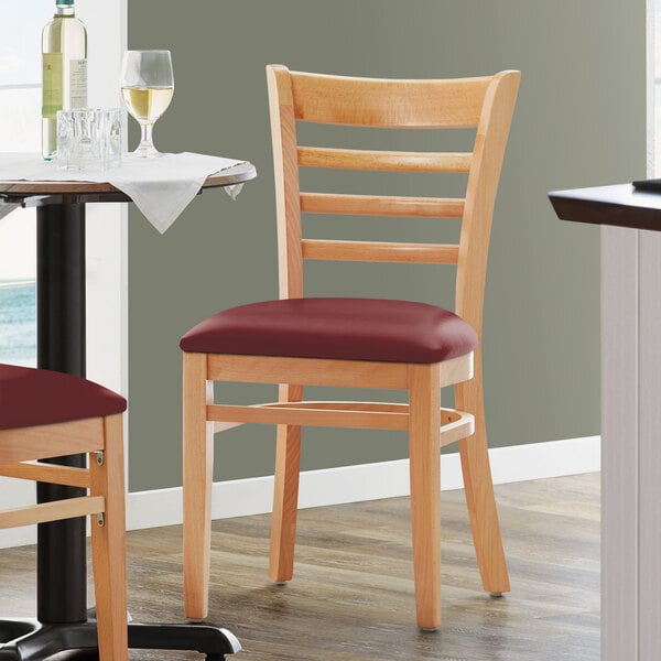 Lancaster Table & Seating Natural Finish Wooden Ladder Back Chair with 2 1/2" Burgundy Padded Seat