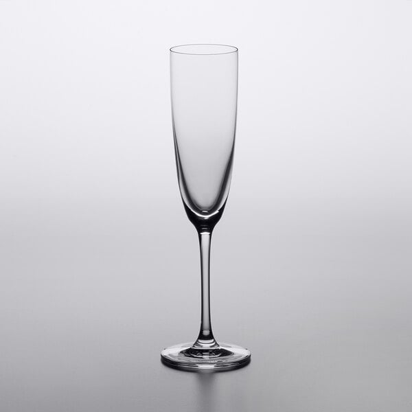 A Lucaris Temptation wine glass with a long stem and flute shape.