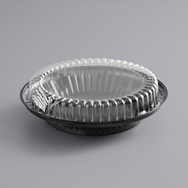 A black plastic pie container with a clear low dome lid.