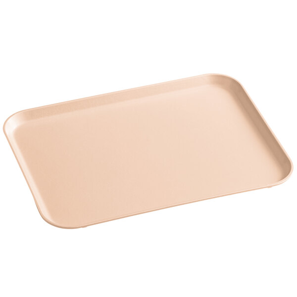 A rectangular peach fiberglass MFG Tray with a small handle.