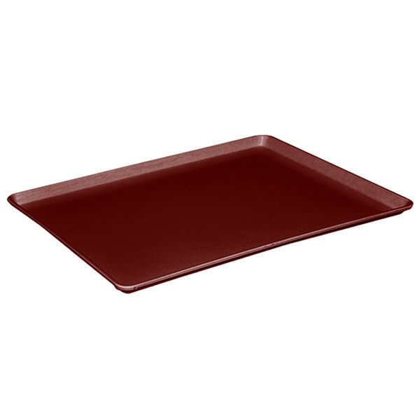 A red rectangular MFG Tray on a white table.