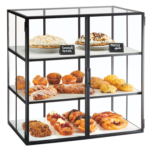 A Cal-Mil Monterey bakery display case filled with pastries.