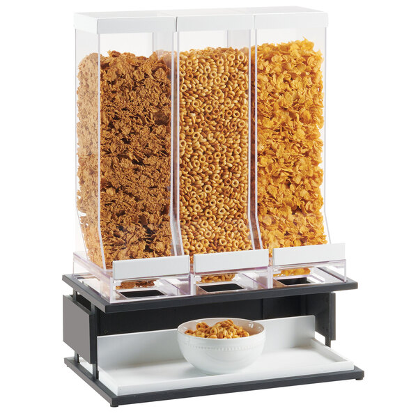 A Cal-Mil triple cereal dispenser with three bowls of cereal.