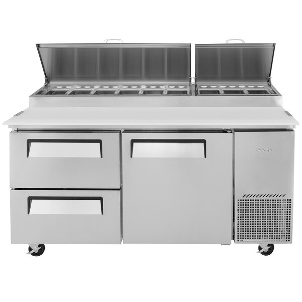 A Turbo Air stainless steel pizza prep table with 1 door and 2 drawers.