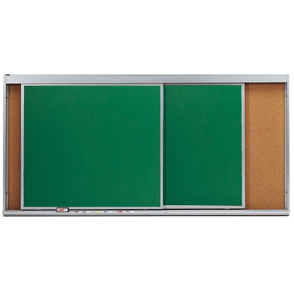A green chalkboard with a white border on a metal cork board.