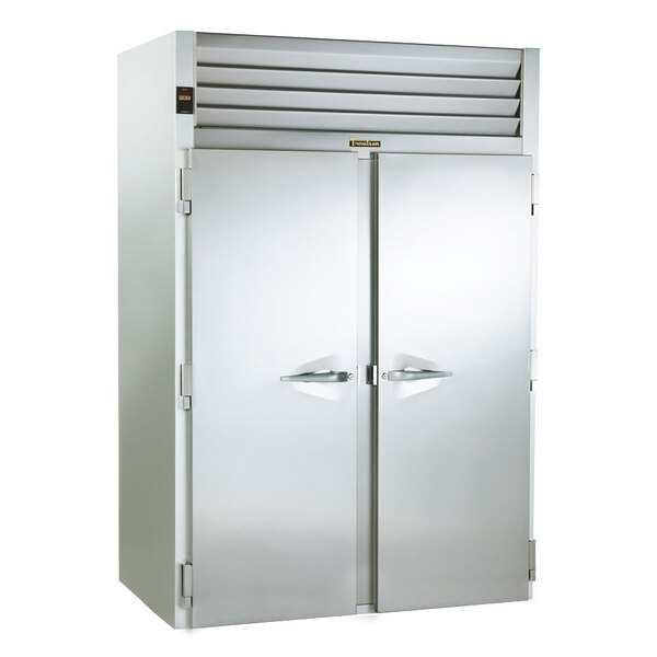 A large silver Traulsen roll-in refrigerator with two doors.