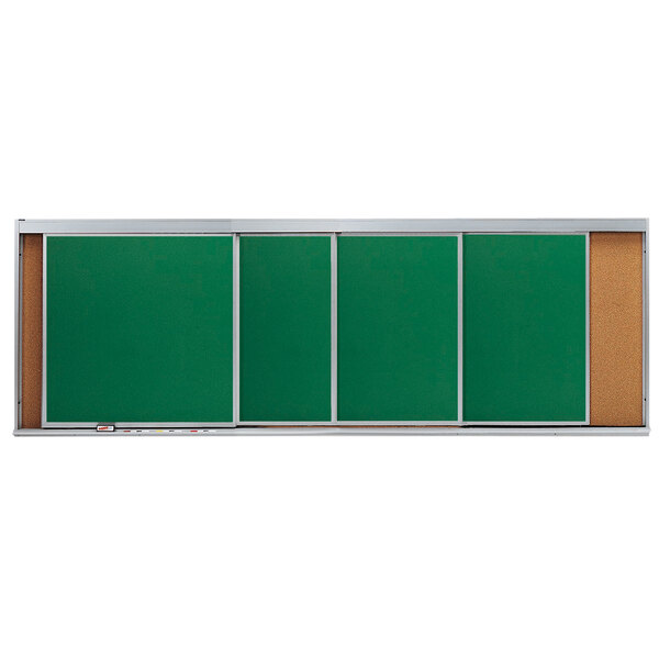 A green board with a white border and cork board in the center and white trim with 4 horizontal sliding chalk boards on the bottom.
