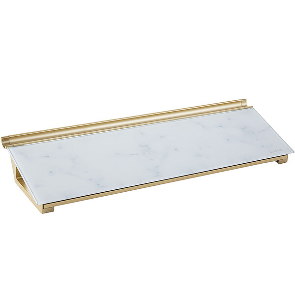 A white marble and gold rectangular desktop pad.