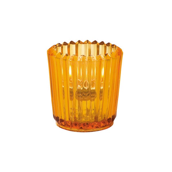 A Hollowick amber ribbed glass tealight holder with a lit orange candle inside.