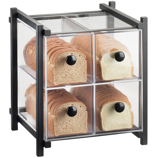 A black plastic drawer with four loaves of bread in a Cal-Mil bakery display case.