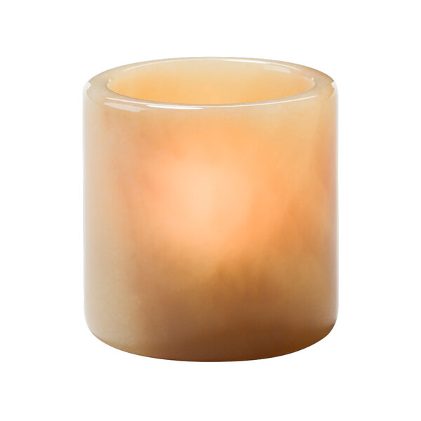 A beige candle burning in a Hollowick mini cylinder lamp.