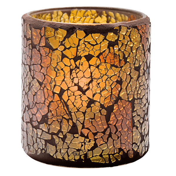 A Hollowick crackle gold frosted glass votive candle holder with a lit candle inside.