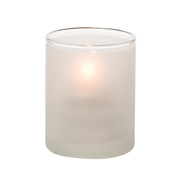 A Hollowick satin crystal glass cylinder tealight holder with a lit candle inside.