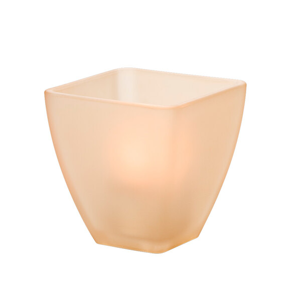 A Hollowick Odyssey Amber Satin Crystal glass square candle holder with a lit candle inside.