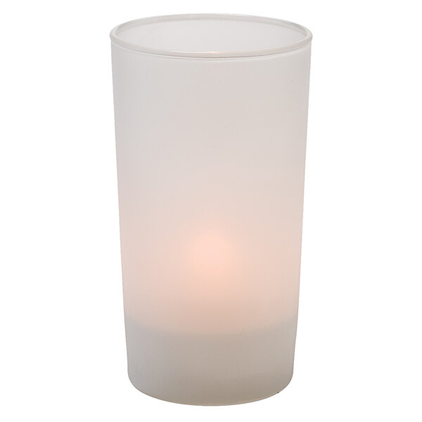 A white candle in a Hollowick satin linen glass votive holder.