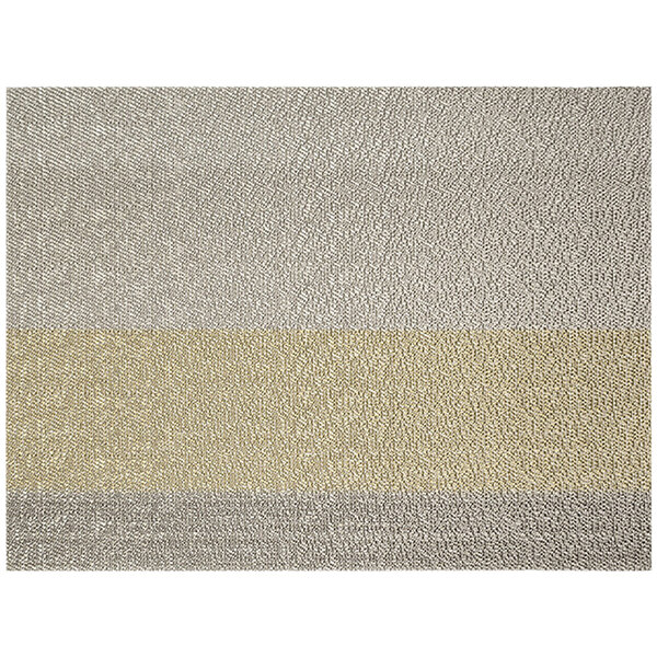 A metallic mesh woven vinyl placemat with a striped pattern in grey and yellow.